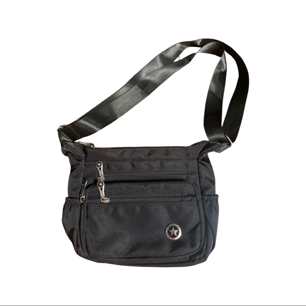 Like new black nylon bigger crossbody/shoulder bag. Lots of zippered pockets.